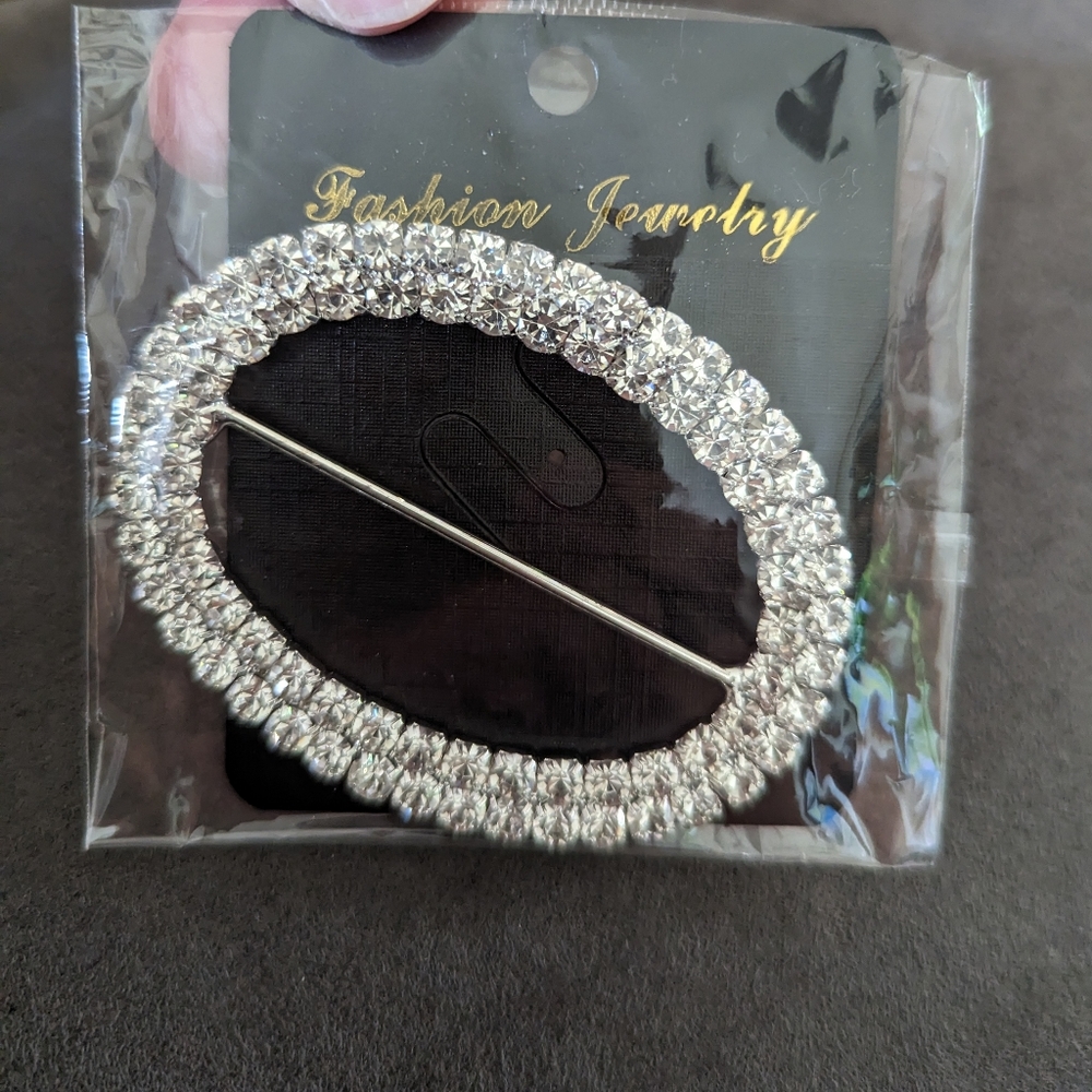 Silver jeweled belt buckle